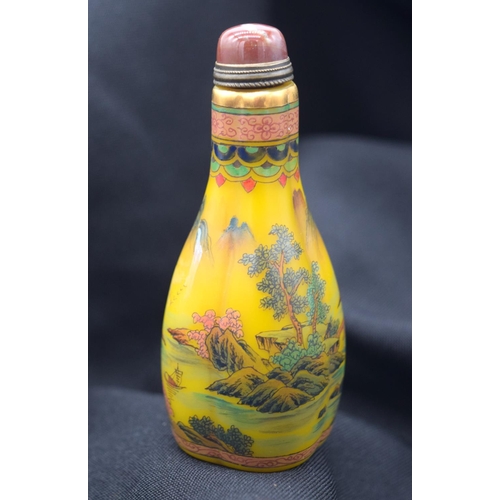 4224 - A Chinese glass snuff bottle decorated with  mountains  birds and foliage 9 cm .