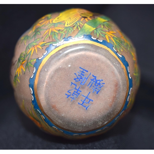 4225 - A Chinese glass snuff bottle decorated with insects and foliage 7 cm .