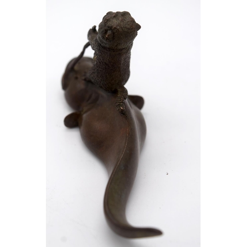 4231 - A Japanese small bronze Catfish being ridden by a beaver  12cm.