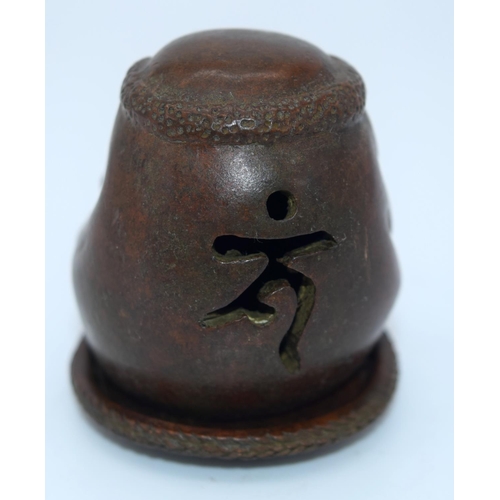 4239 - A Japanese small bronze figure of a grotesque head  12cm (2).