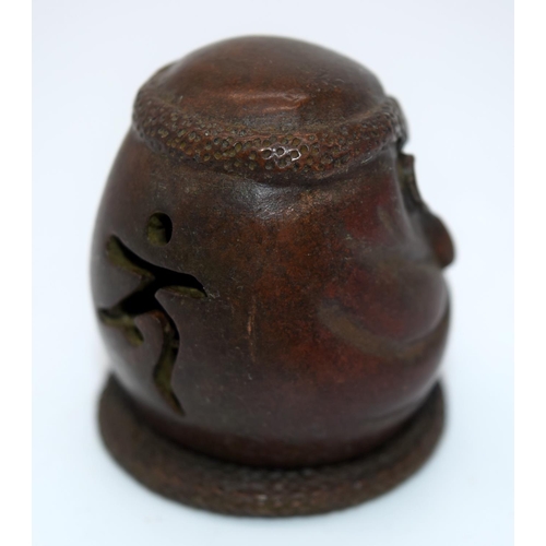 4239 - A Japanese small bronze figure of a grotesque head  12cm (2).