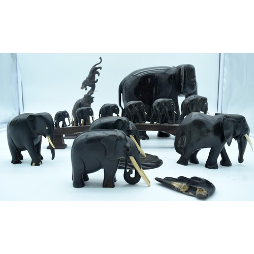 4267 - A collection of hardwood Indian and African Elephants 25 x 20cm (7).