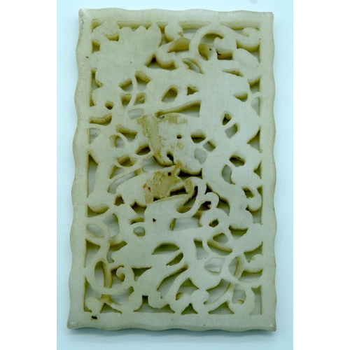 4273 - A Chinese Jade carved panel depicting dragons 6 x 9.5cm.