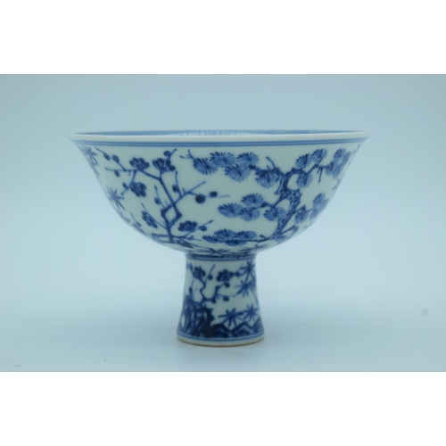 4279 - A Chinese blue and white Stem cup decorated with Plum, orchids and flowers 16 x 11cm