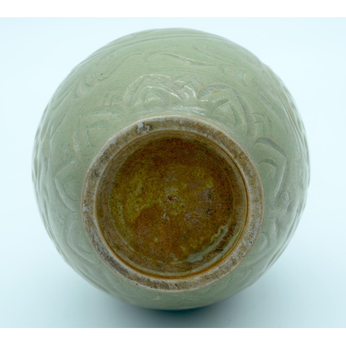 4342 - A Chinese green glazed vase with a floral pattern 24 x 13cm.