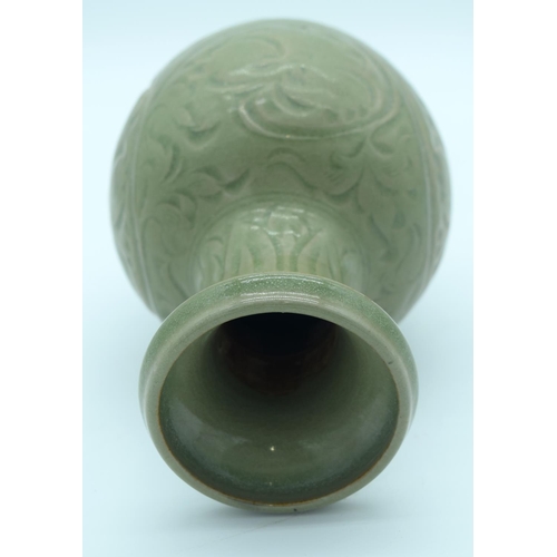 4342 - A Chinese green glazed vase with a floral pattern 24 x 13cm.