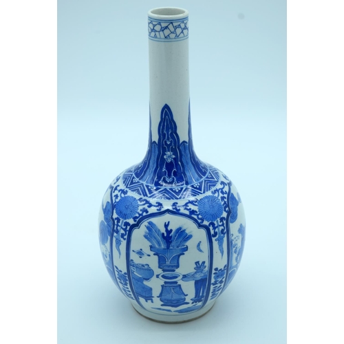 4343 - A Chinese blue and white porcelain vase decorated with foliage .Kangxi mark 28 x 13cm.