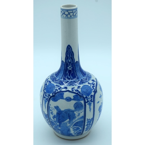 4343 - A Chinese blue and white porcelain vase decorated with foliage .Kangxi mark 28 x 13cm.