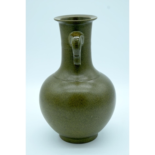 4344 - A Chinese  tea dust glazed vase with twin Elephant trunk handles 34 x 21cm.