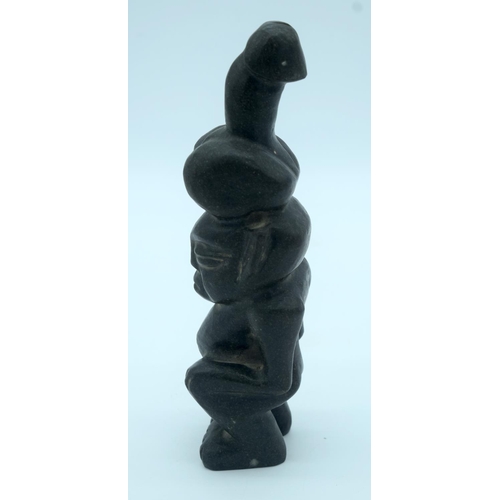 4348 - A Chinese hard stone statue of a male with a penis on his head 26 x 7cm.