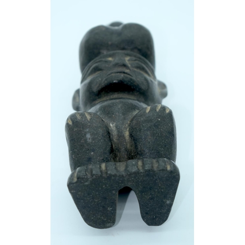 4348 - A Chinese hard stone statue of a male with a penis on his head 26 x 7cm.