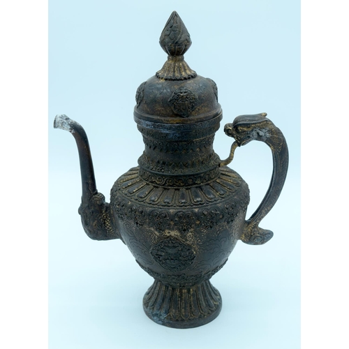 4350 - A bronze  lidded dragon handled Tibetan oil ewer 38 x 28 cm.