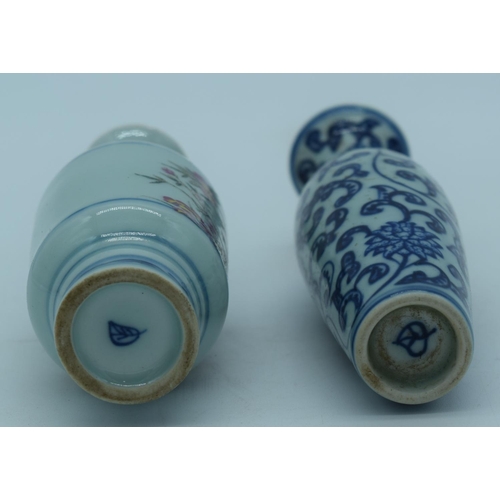 4431 - A small Chinese vase decorated with blue and white foliage together with another vase 16 cm (2)