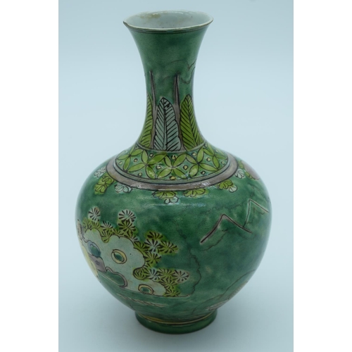 4435 - A Chinese green glaze vase decorated with kite flyers 19cm.