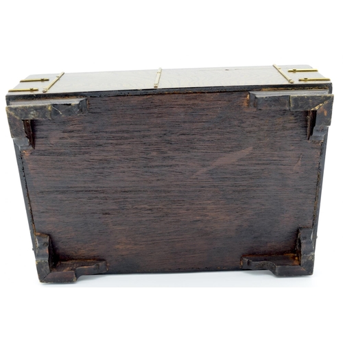 4472 - A wooden Chinese box with brass fittings and a fish lock and a calligraphy paper lining 32 x 22cm