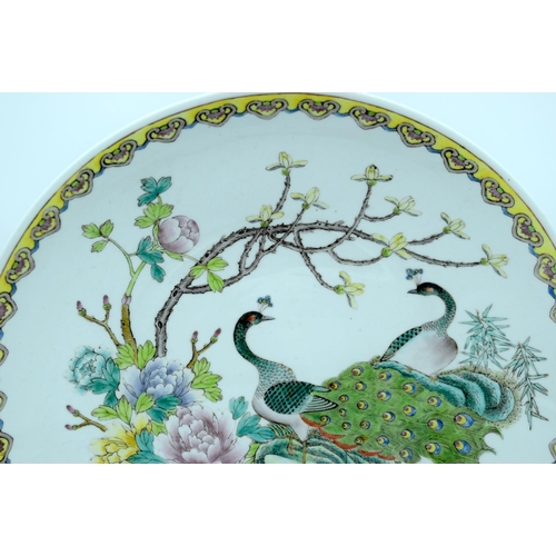 4479 - A large  Chinese  Charger decorated with peacocks and foliage 36 x 6.5cm.