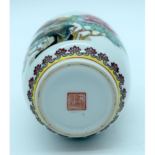 4481 - A small Chinese Famille Rose vase decorated with a bird and foliage 15cm