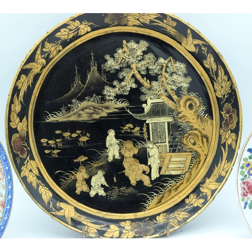 4485 - A Chinese Lacquered dish together with a Chinese Blue and white dragon plate and another 34cm .(3)