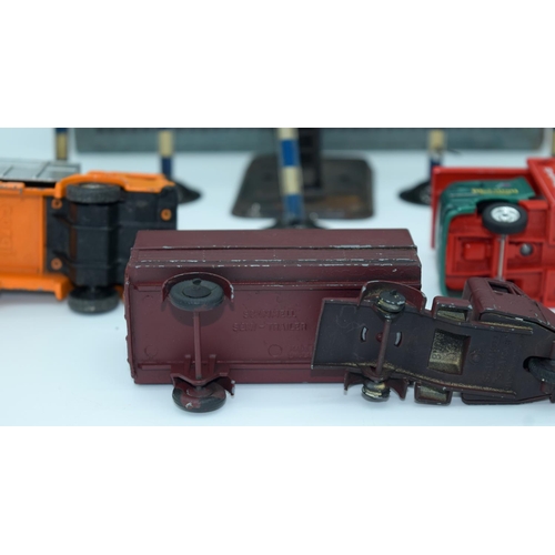 4486 - A collection of  model railway signals, a Hornby box and Corgi model trucks. (Qty)