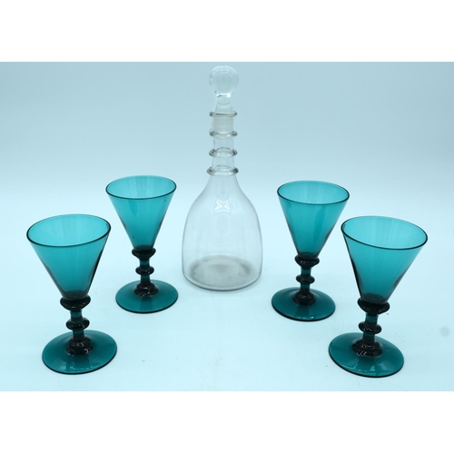 4551 - A Georgian decanter and four 19th century Bristol glasses with blade knop stems. 25 cm .(5)