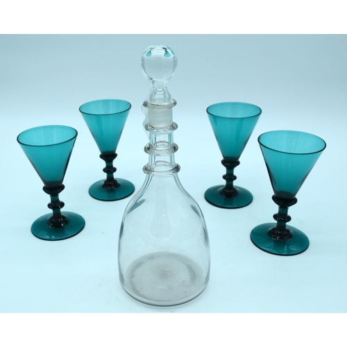 4551 - A Georgian decanter and four 19th century Bristol glasses with blade knop stems. 25 cm .(5)