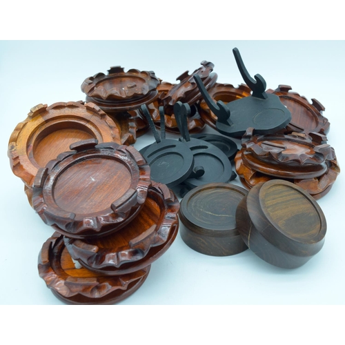 4555 - Group of Chinese wooden vase stands and wooden cup and saucer stands largest 15cm . (Qty)