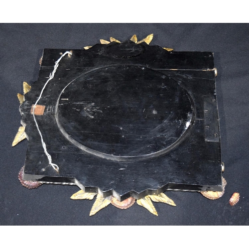 4608 - A glass framed mirror decorated with flowers and leaves 42 x 42cm .