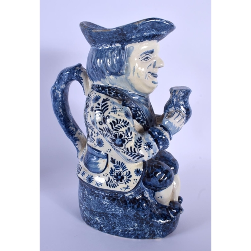 55 - AN ANTIQUE DUTCH BLUE AND WHITE DELFT POTTERY TOBY JUG modelled as a male holding an ale jug. 27 cm ... 