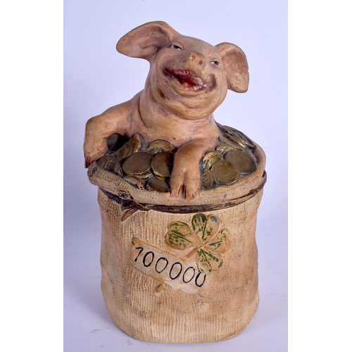 698 - AN ANTIQUE AUSTRIAN TOBACCO JAR AND COVER in the form of a pig in money. 22 cm high.