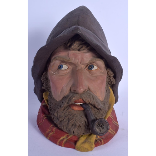 699 - AN ANTIQUE AUSTRIAN TOBACCO JAR AND COVER in the form of a smoking fisherman. 21 cm high.