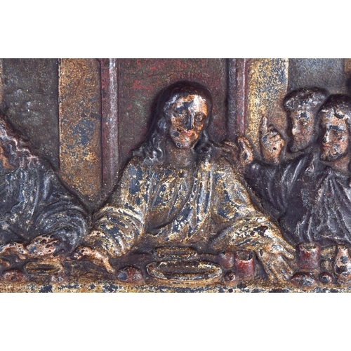 712 - A RARE 19TH CENTURY CONTINENTAL CAST IRON PANEL depicting the last supper. 65 cm x 37 cm.