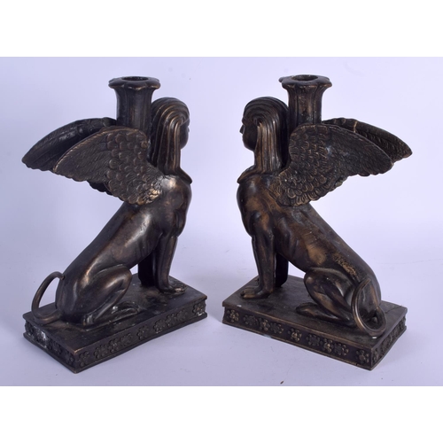 715 - A PAIR OF CONTINENTAL BRONZE GRAND TOUR INSPIRED SPHINX CANDLESTICKS. 28 cm x 19 cm.