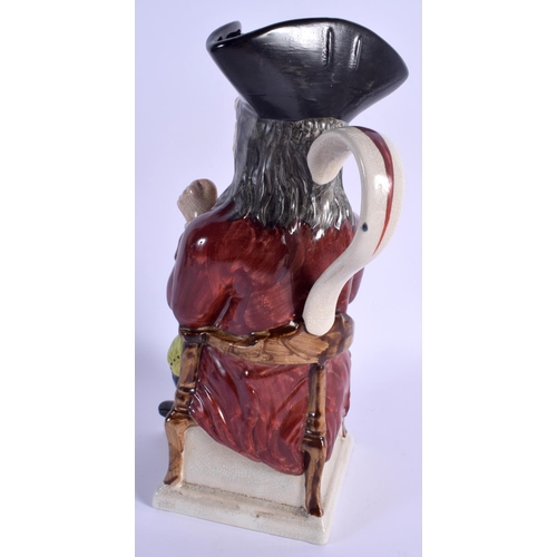 72 - A LARGE 19TH CENTURY CONTINENTAL POTTERY CHARACTER TONY JUG modelled taking snuff. 31 cm high.