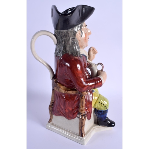 72 - A LARGE 19TH CENTURY CONTINENTAL POTTERY CHARACTER TONY JUG modelled taking snuff. 31 cm high.