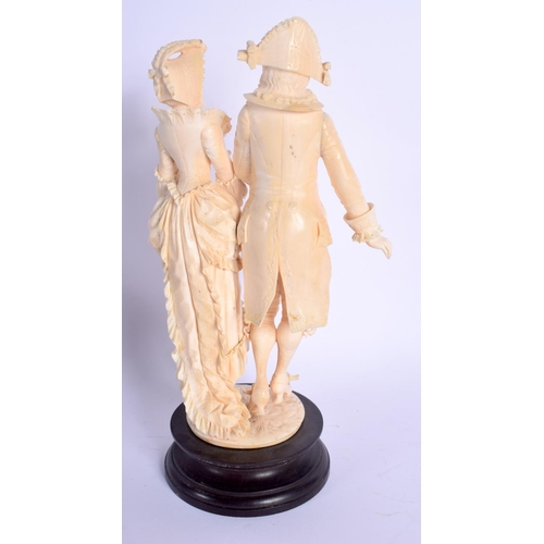 724 - A FINE 19TH CENTURY EUROPEAN DIEPPE IVORY FIGURE OF A DANDY modelled with a female, upon a wooden pl... 