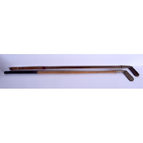 733 - TWO VINTAGE GOLF CLUBS. 85 cm long. (2)