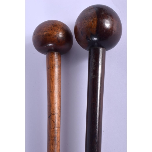 735 - TWO TRIBAL HARDWOOD CLUBS. 71 cm long. (2)