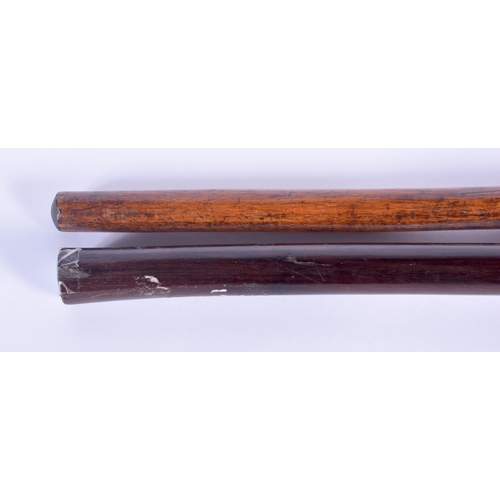 735 - TWO TRIBAL HARDWOOD CLUBS. 71 cm long. (2)