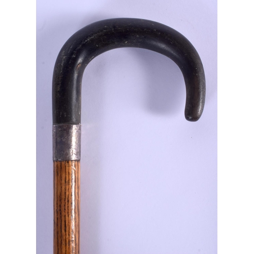 736 - A 19TH CENTURY CONTINENTAL CARVED RHINOCEROS HORN HANDLED WALKING CANE. 80 cm long.