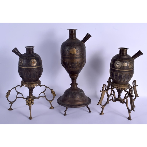 737 - A LARGE 19TH CENTURY MIDDLE EASTERN INDIAN BRONZE HOOKAH PIPE together with two others. Largest 44 c... 