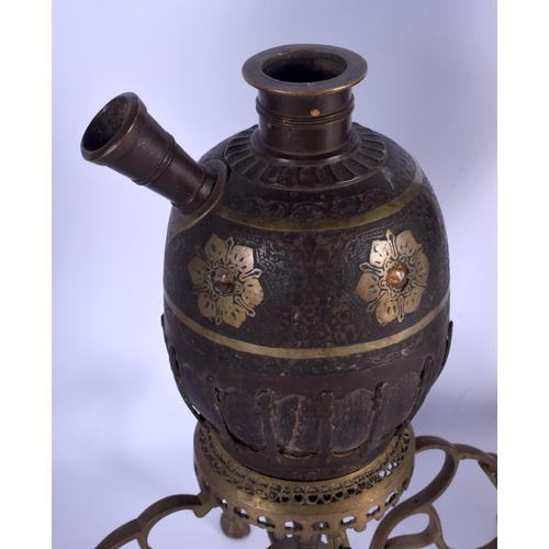 737 - A LARGE 19TH CENTURY MIDDLE EASTERN INDIAN BRONZE HOOKAH PIPE together with two others. Largest 44 c... 