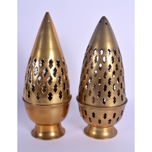 745 - AN UNUSUAL PAIR OF INDIAN BRASS CANDLESTICKS AND COVERS. 19 cm high.