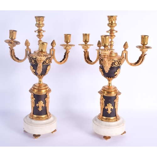 754 - A LARGE PAIR OF 19TH CENTURY FRENCH EGYPTIAN REVIVAL BRONZE CANDLESTICKS decorated with figures and ... 