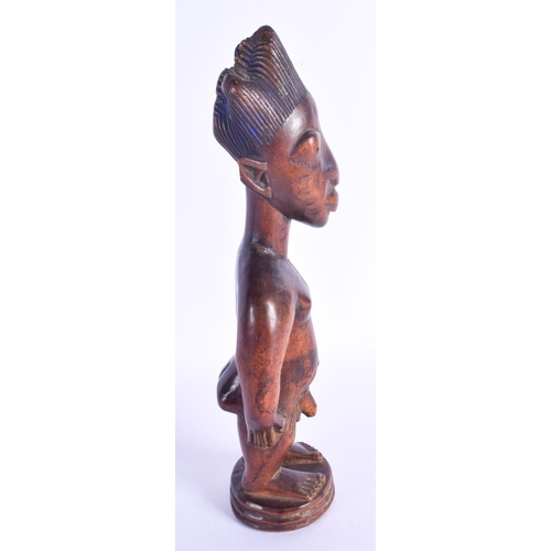 756 - A FINE MALE IBEJI TWIN FIGURE modelled in the style of the Igbuke of Oyo. 27 cm high.