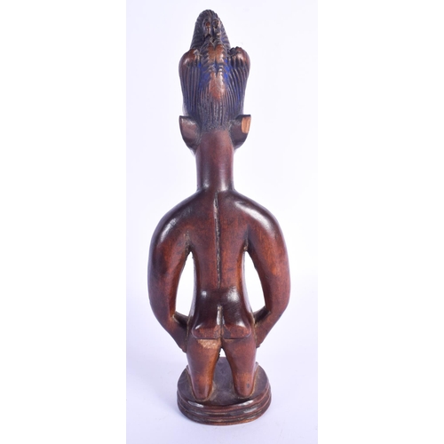 756 - A FINE MALE IBEJI TWIN FIGURE modelled in the style of the Igbuke of Oyo. 27 cm high.