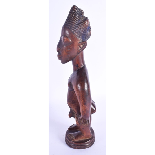 756 - A FINE MALE IBEJI TWIN FIGURE modelled in the style of the Igbuke of Oyo. 27 cm high.