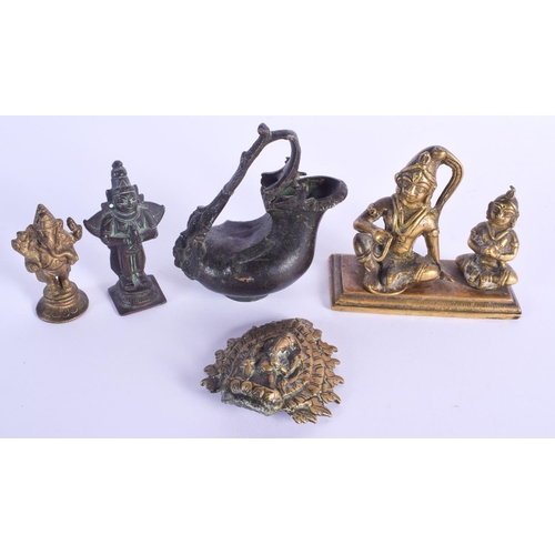 760 - AN EARLY INDIAN BRONZE EWER together with other Hindu bronzes. Largest 9 cm x 11 cm. (5)