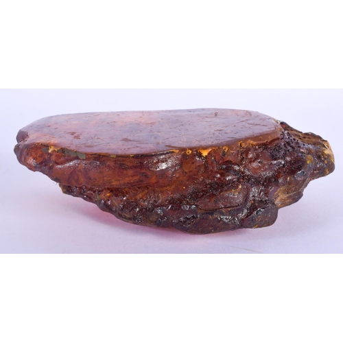 773 - A CONTINENTAL CARVED AMBER NATURALISTIC BOULDER. 481 grams. 16 cm x 11 cm.