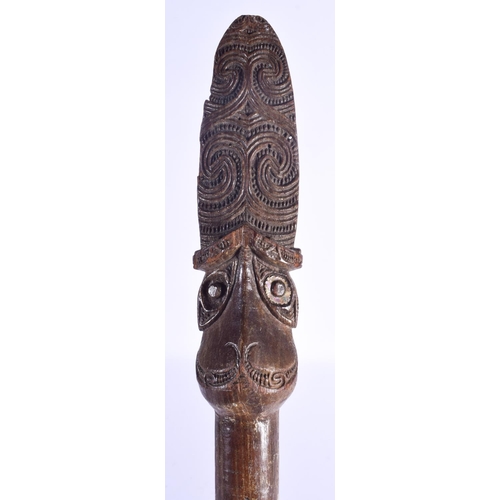 801 - A LARGE MAORI CARVED WOOD STAFF Taiaha, with shell inset eyes and carved zig zag spiralised motifs. ... 