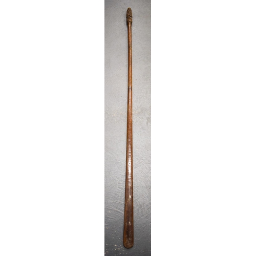 801 - A LARGE MAORI CARVED WOOD STAFF Taiaha, with shell inset eyes and carved zig zag spiralised motifs. ... 